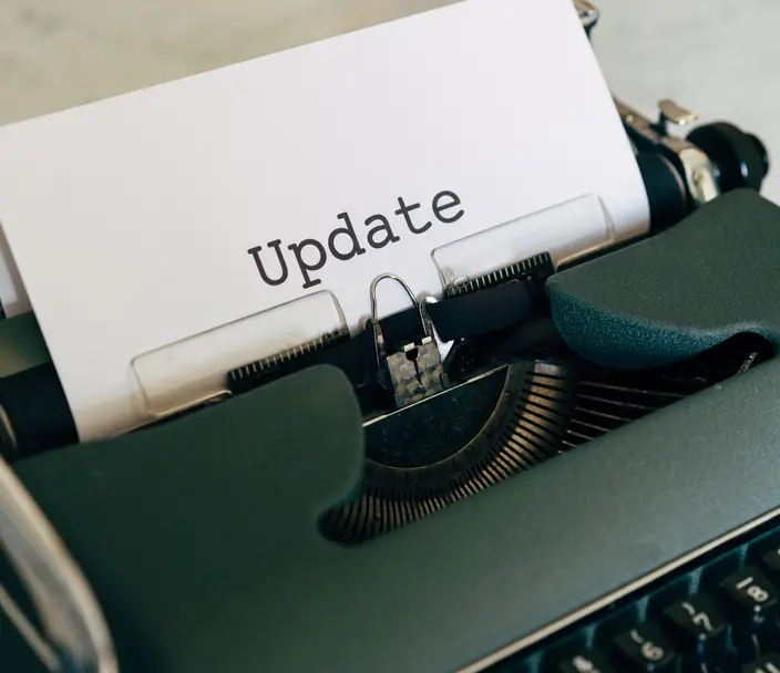 Typewriter with the word "update" written on paper